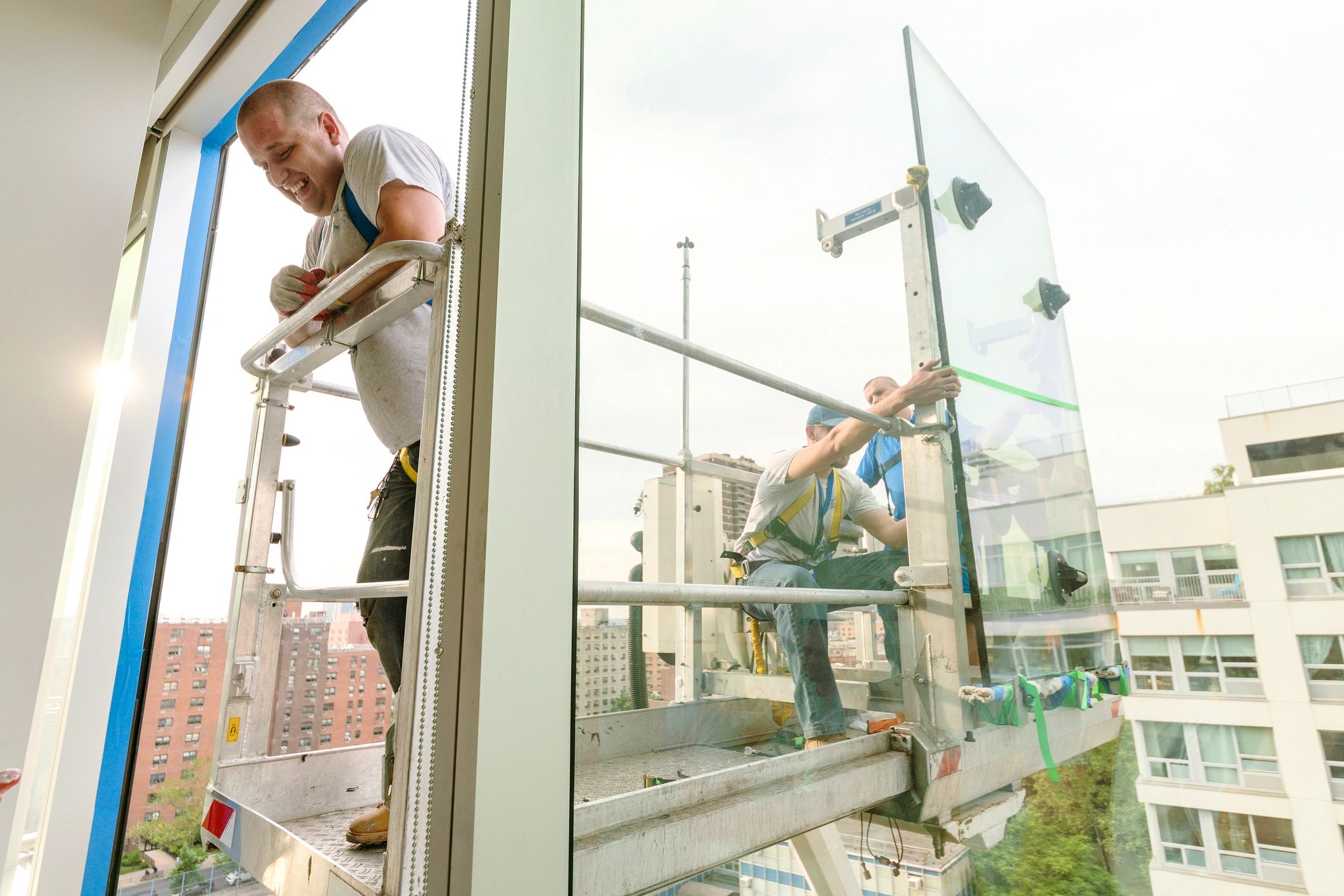Facade installation crew on a lift platform
