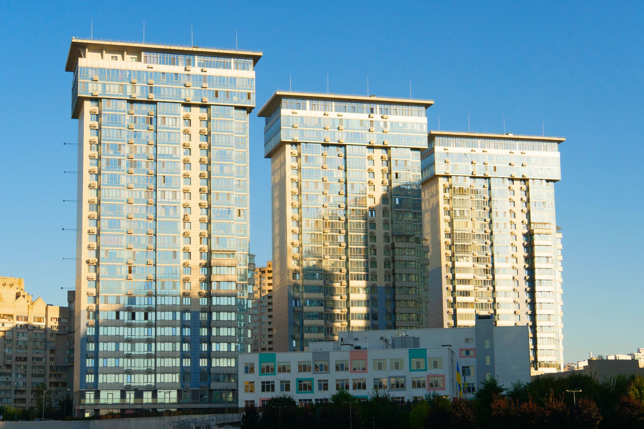 Modern high-rise buildings with glass facades under a clear sky